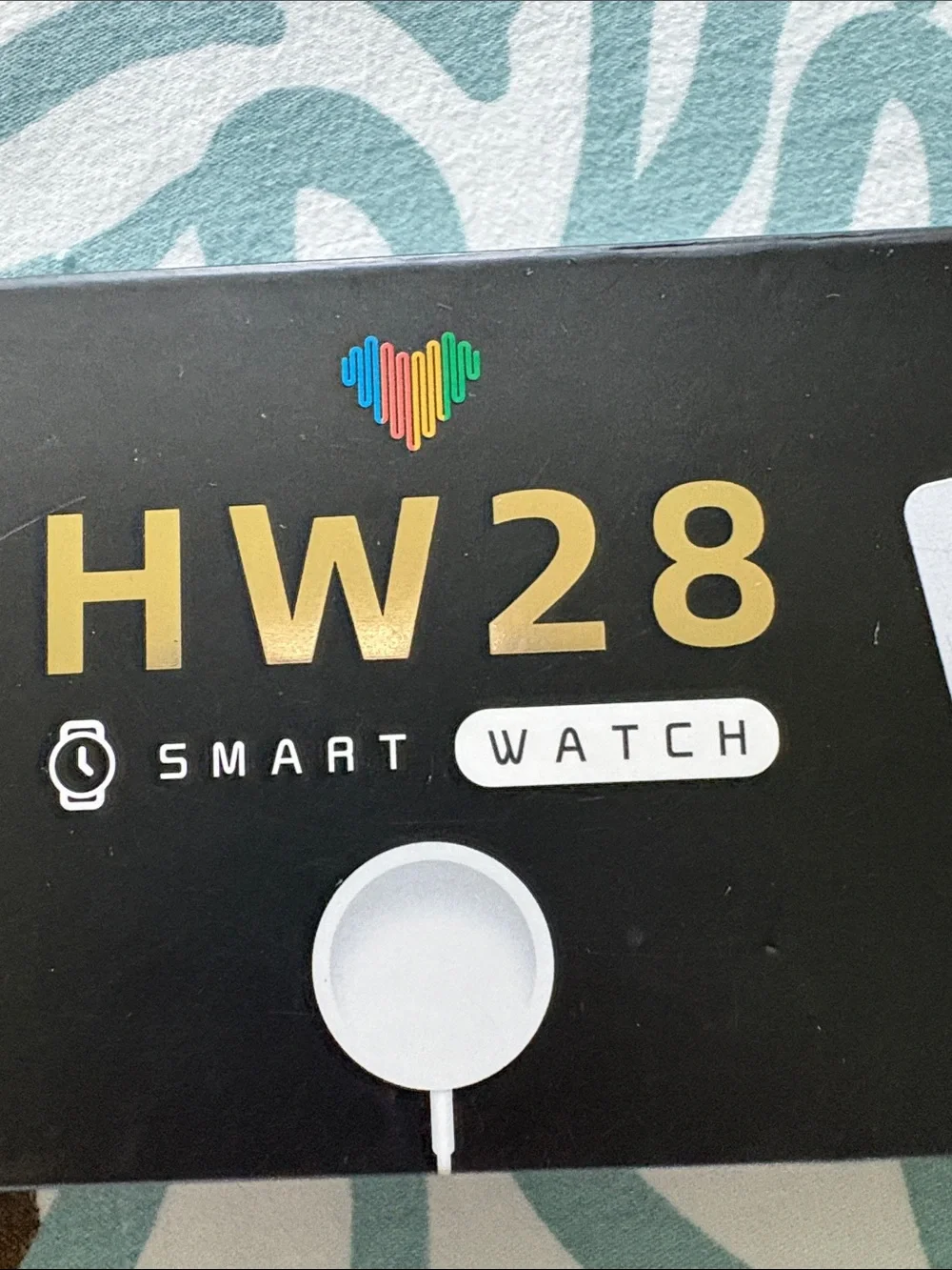 HW 28 smartwatch with charger and case